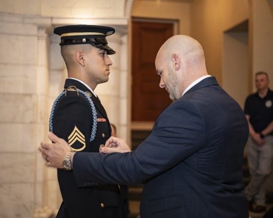 Former Tomb Guard Pins Son with Badge